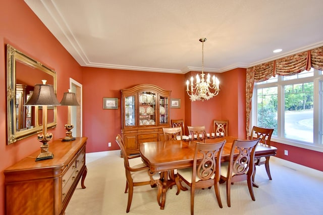 carpeted dining area featuring a notable chandelier