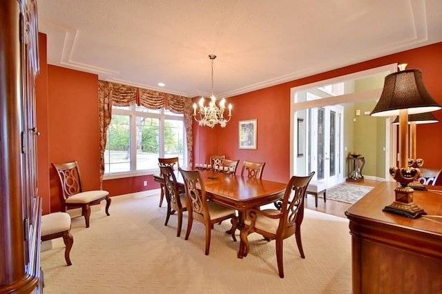 dining room featuring french doors and a chandelier