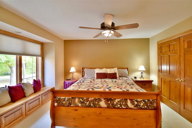 bedroom featuring carpet floors, a closet, and ceiling fan