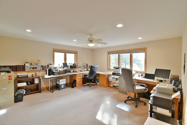 office area featuring light colored carpet and ceiling fan