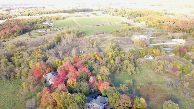 birds eye view of property featuring a water view and a rural view