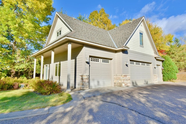 view of side of property featuring covered porch