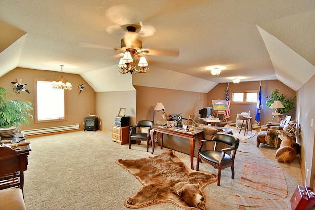 carpeted home office featuring ceiling fan with notable chandelier, vaulted ceiling, and baseboard heating