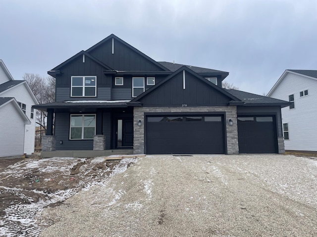 view of front of home with a garage and covered porch