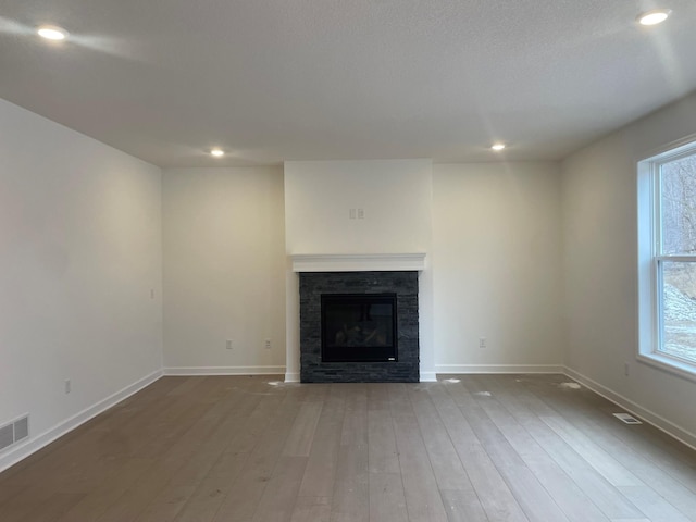 unfurnished living room with hardwood / wood-style floors