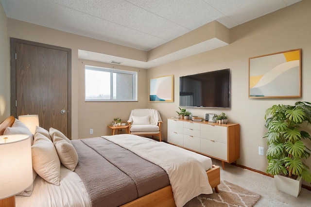 carpeted bedroom with a textured ceiling