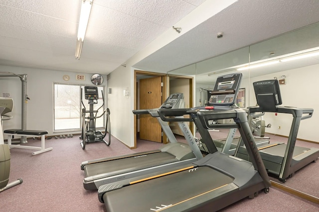 exercise room featuring a textured ceiling