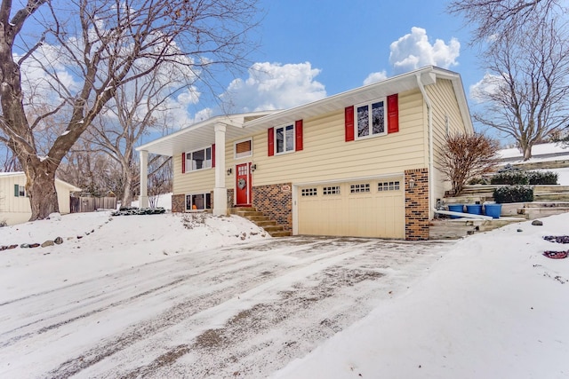 raised ranch featuring a garage