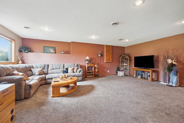 carpeted living room featuring a textured ceiling