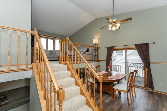 dining room with stairs, a wealth of natural light, a ceiling fan, and wood finished floors