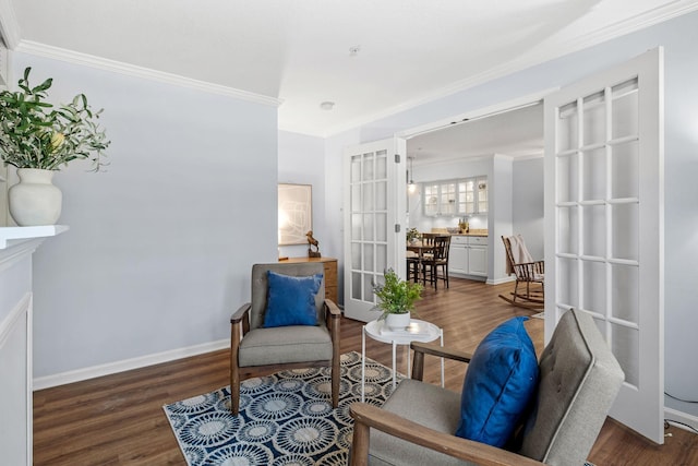 living area featuring dark wood-type flooring and ornamental molding