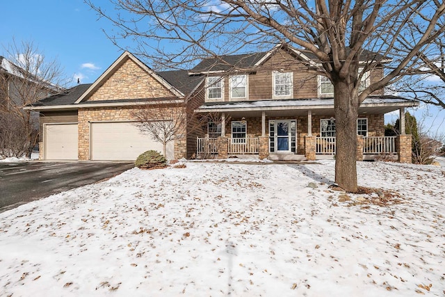 view of front of house featuring a garage and covered porch