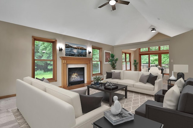 carpeted living room featuring vaulted ceiling, ceiling fan, and plenty of natural light