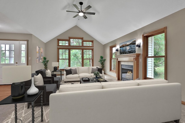 living room with plenty of natural light, lofted ceiling, and ceiling fan