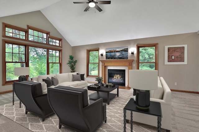 carpeted living room with ceiling fan and vaulted ceiling