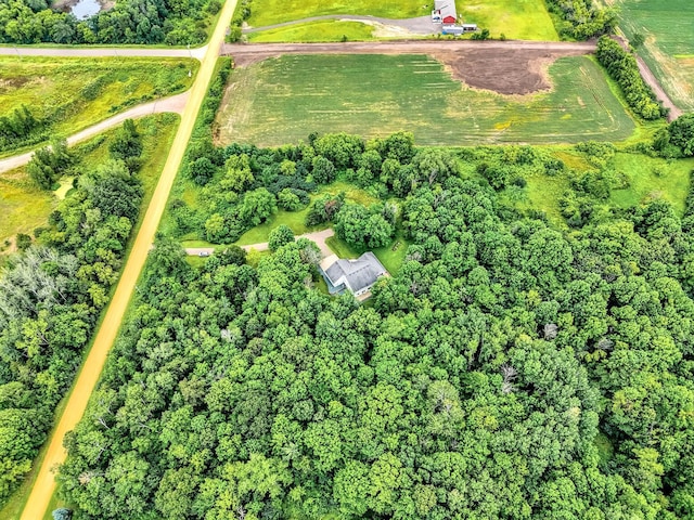 birds eye view of property with a rural view