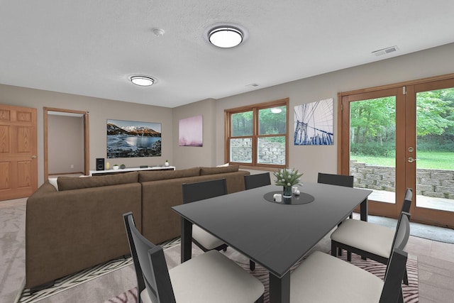 dining room featuring a textured ceiling