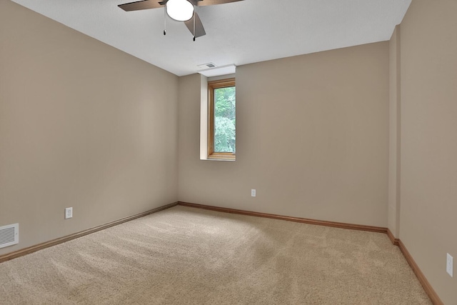 carpeted empty room with ceiling fan