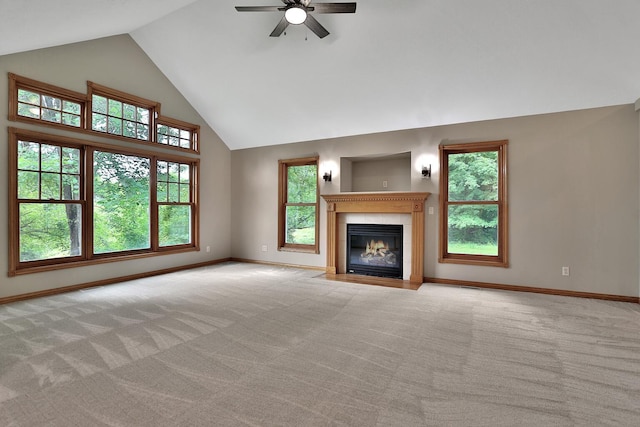 unfurnished living room featuring ceiling fan, light colored carpet, and high vaulted ceiling