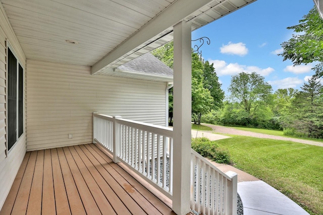 deck featuring a yard