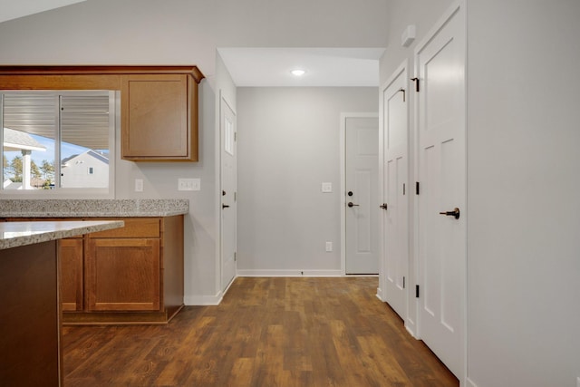 corridor featuring dark hardwood / wood-style flooring