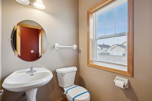 bathroom with toilet and sink