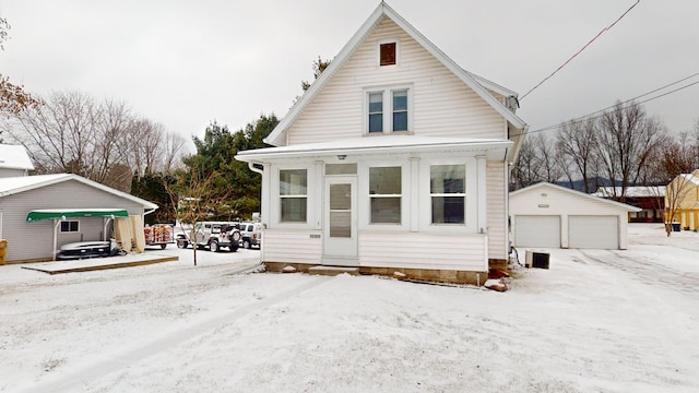 view of front of home with an outdoor structure and a garage