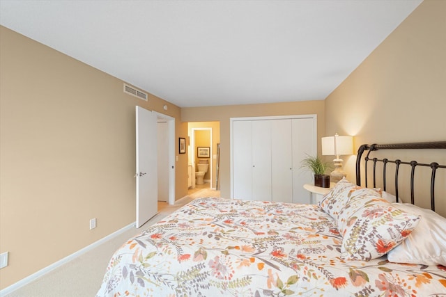 bedroom with light colored carpet and a closet