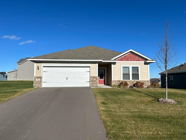 view of front facade with a front lawn and a garage