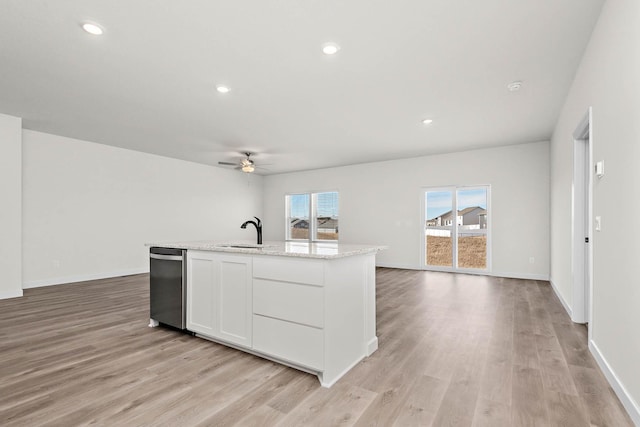 451 Wildflower Ln, Waverly, MN 55390 - kitchen with stainless steel dishwasher, open floor plan, a ceiling fan, light wood finished floors, and recessed lighting
