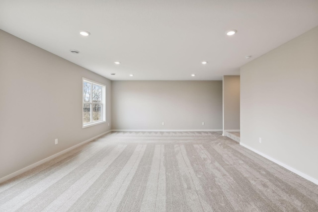 unfurnished room with light carpet