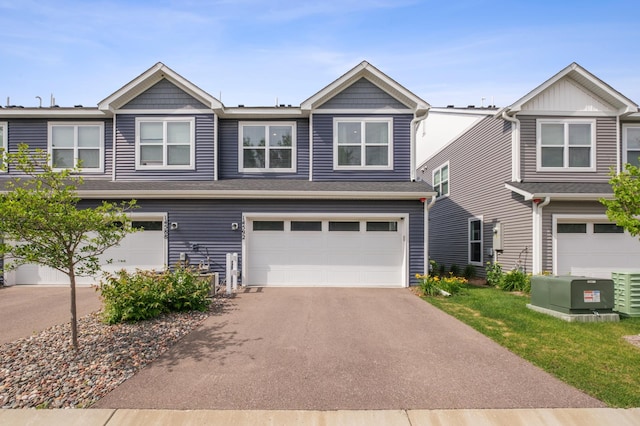 14592 Twin Lakes Cir, Burnsville, MN 55306 - townhome / multi-family property with an attached garage and driveway