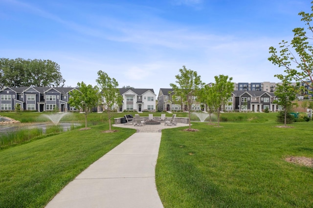 14592 Twin Lakes Cir, Burnsville, MN 55306 - surrounding community with a residential view, a patio area, and a lawn