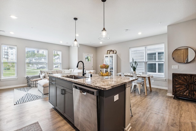 14592 Twin Lakes Cir, Burnsville, MN 55306 - kitchen featuring dishwasher, baseboards, a sink, and light wood finished floors