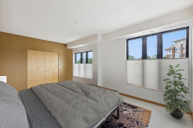 bedroom with a closet and carpet flooring