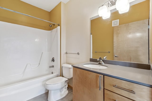 full bathroom featuring tile patterned floors, toilet, tub / shower combination, and vanity