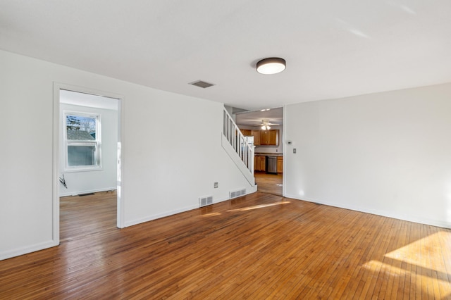 empty room with hardwood / wood-style floors