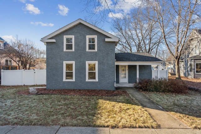 view of front of home with a porch and a front yard