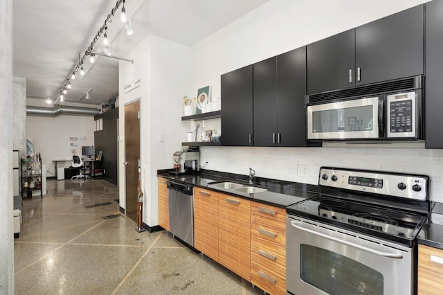 kitchen with decorative backsplash, sink, and appliances with stainless steel finishes