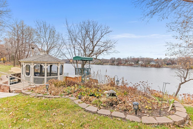 exterior space with a gazebo and a water view