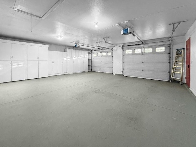 garage featuring a garage door opener