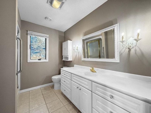 bathroom featuring vanity, tile patterned flooring, toilet, a textured ceiling, and a shower with shower door