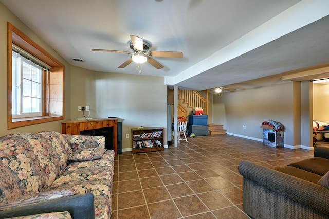 tiled living room featuring ceiling fan