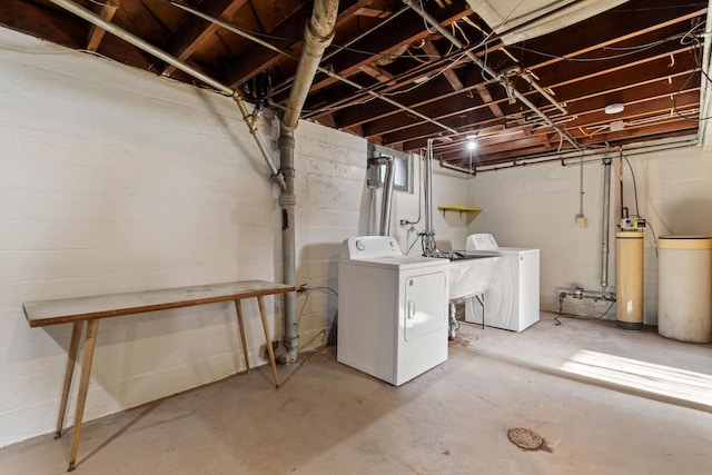 basement with washing machine and dryer and sink