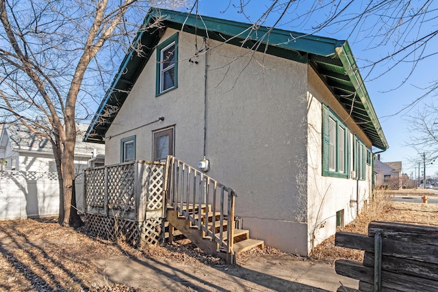 view of property exterior featuring a deck