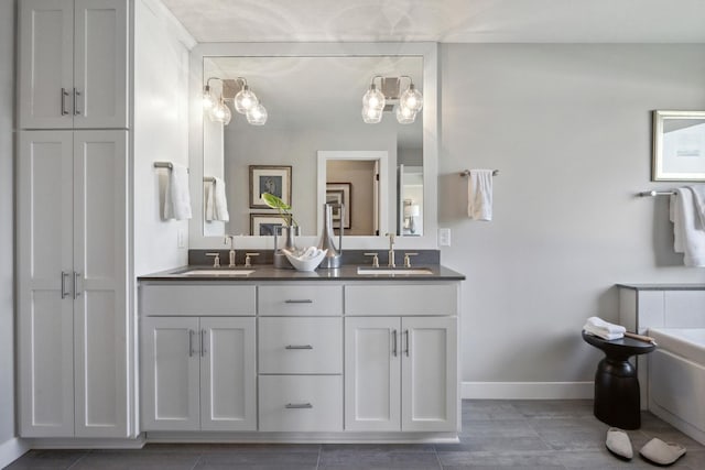 bathroom with vanity and a bath