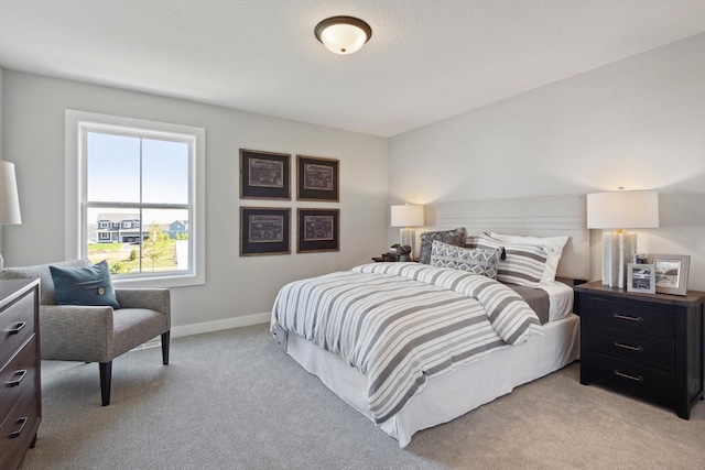 bedroom with light colored carpet