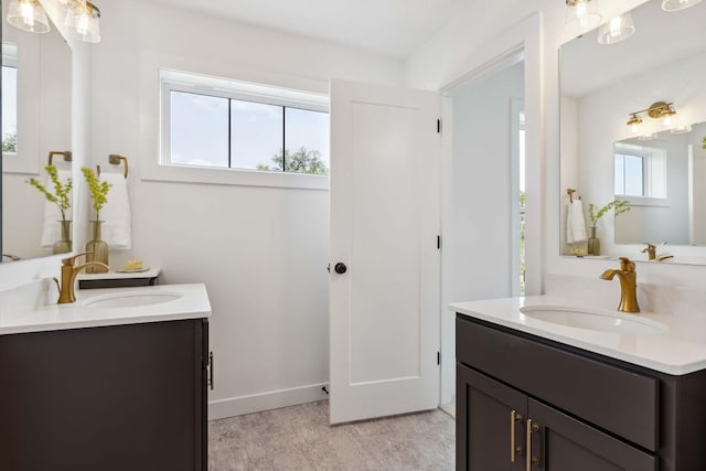 bathroom with hardwood / wood-style flooring, plenty of natural light, and vanity