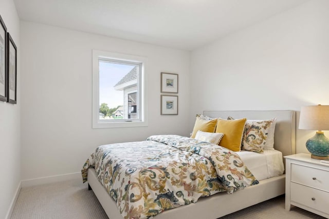 bedroom with light colored carpet