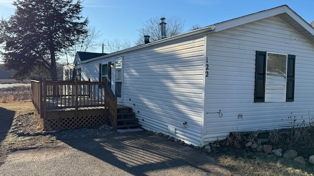 view of side of home featuring a deck